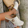 SchrittGlanz | Leder-Clogs mit Blumenprägung & Absatz